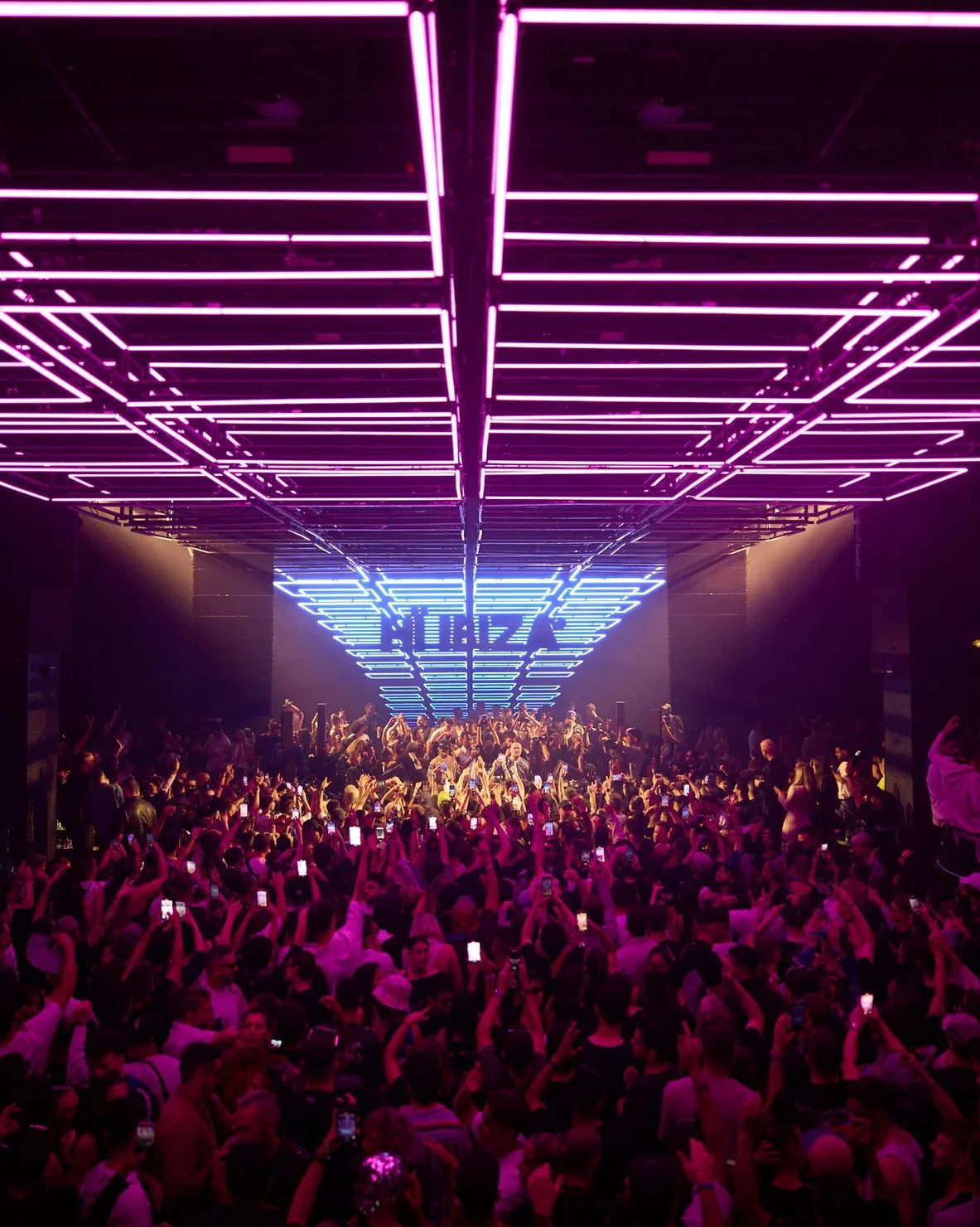 Neon-lit interior of an Ibiza superclub at night