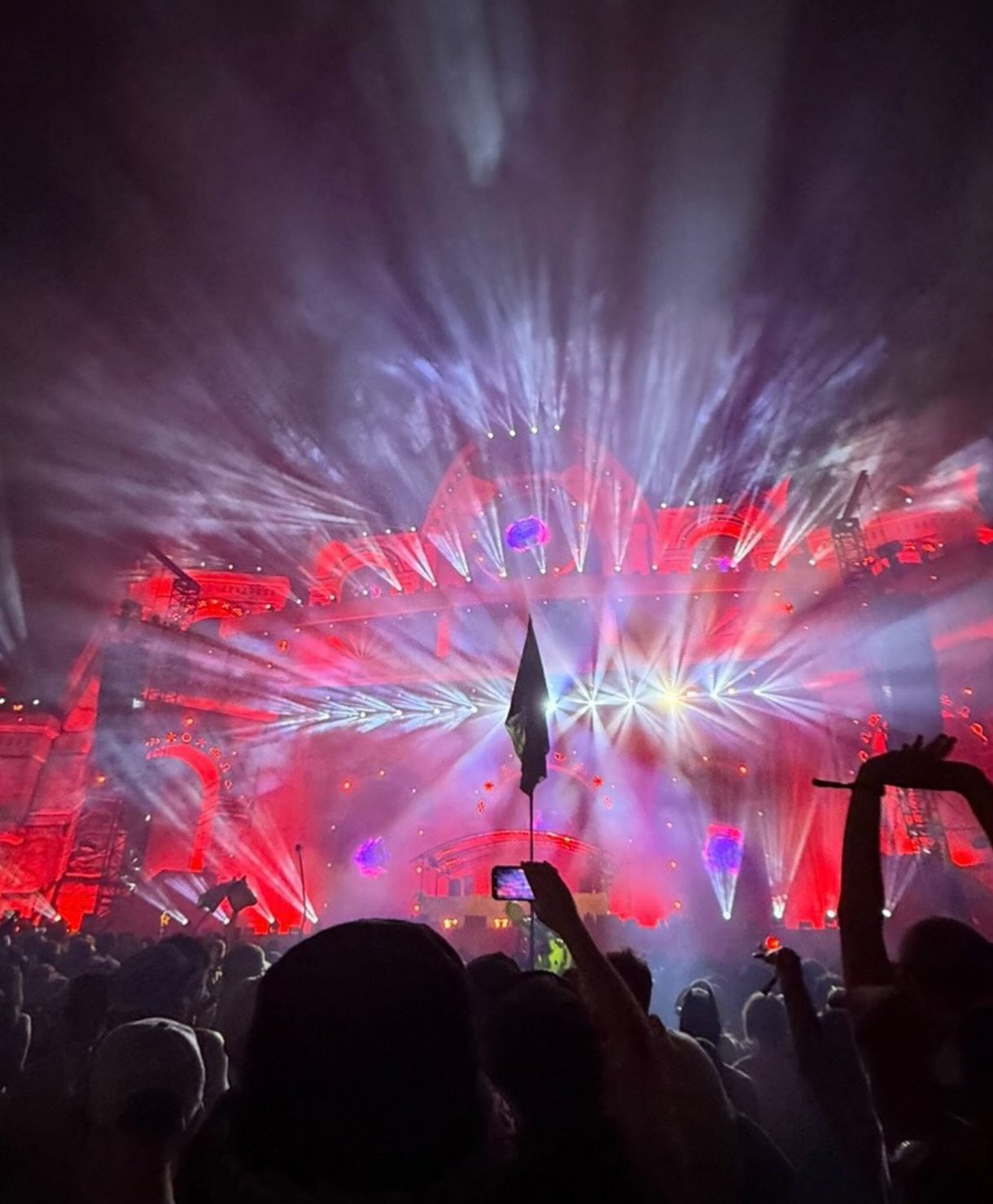 DnB Allstars Festival night stage with red lighting, lasers and crowd at large UK drum and bass event