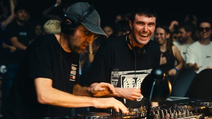 Fred again.. laughing at the decks alongside Thomas Bangalter of Daft Punk during a USB002 back to back