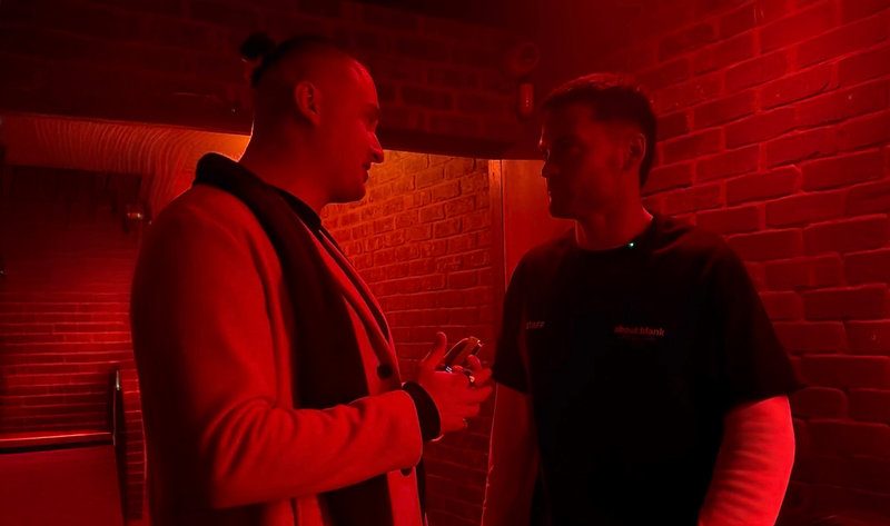 MNEEMO (Yaroslav Gorovoy) and Kirk Allen standing in the corridor of XOYO London nightclub under red lighting during the club’s opening press event.