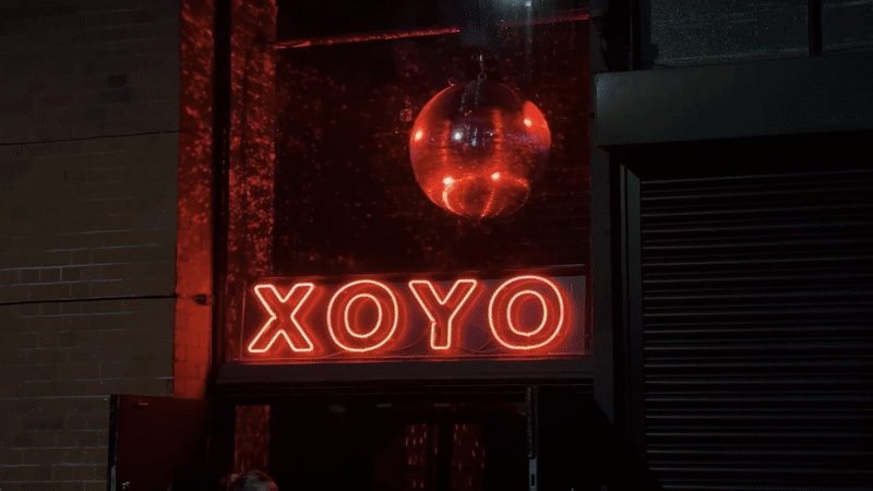 MNEEMO (Yaroslav Gorovoy) and Kirk Allen standing in the corridor of XOYO London nightclub under red lighting during the club’s opening press event.