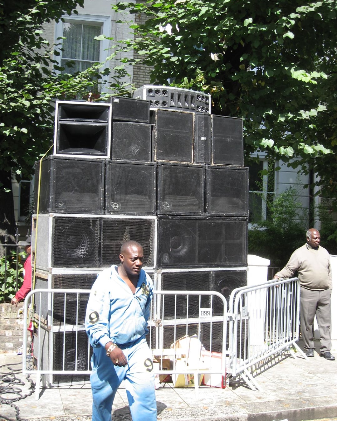 A carnival sound system stacked speaker on speaker at a west London corner