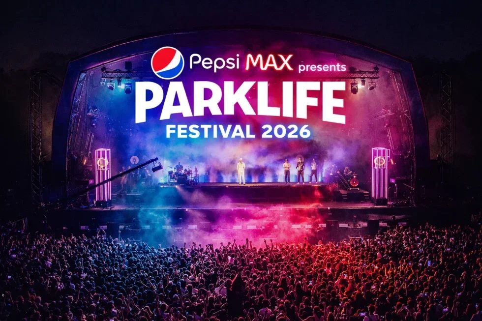 Parklife 2026 poster. Crowd at Parklife Festival 2026 under a lit stage with performers. Vibrant lights and "Pepsi Max presents Parklife Festival 2026" text visible.