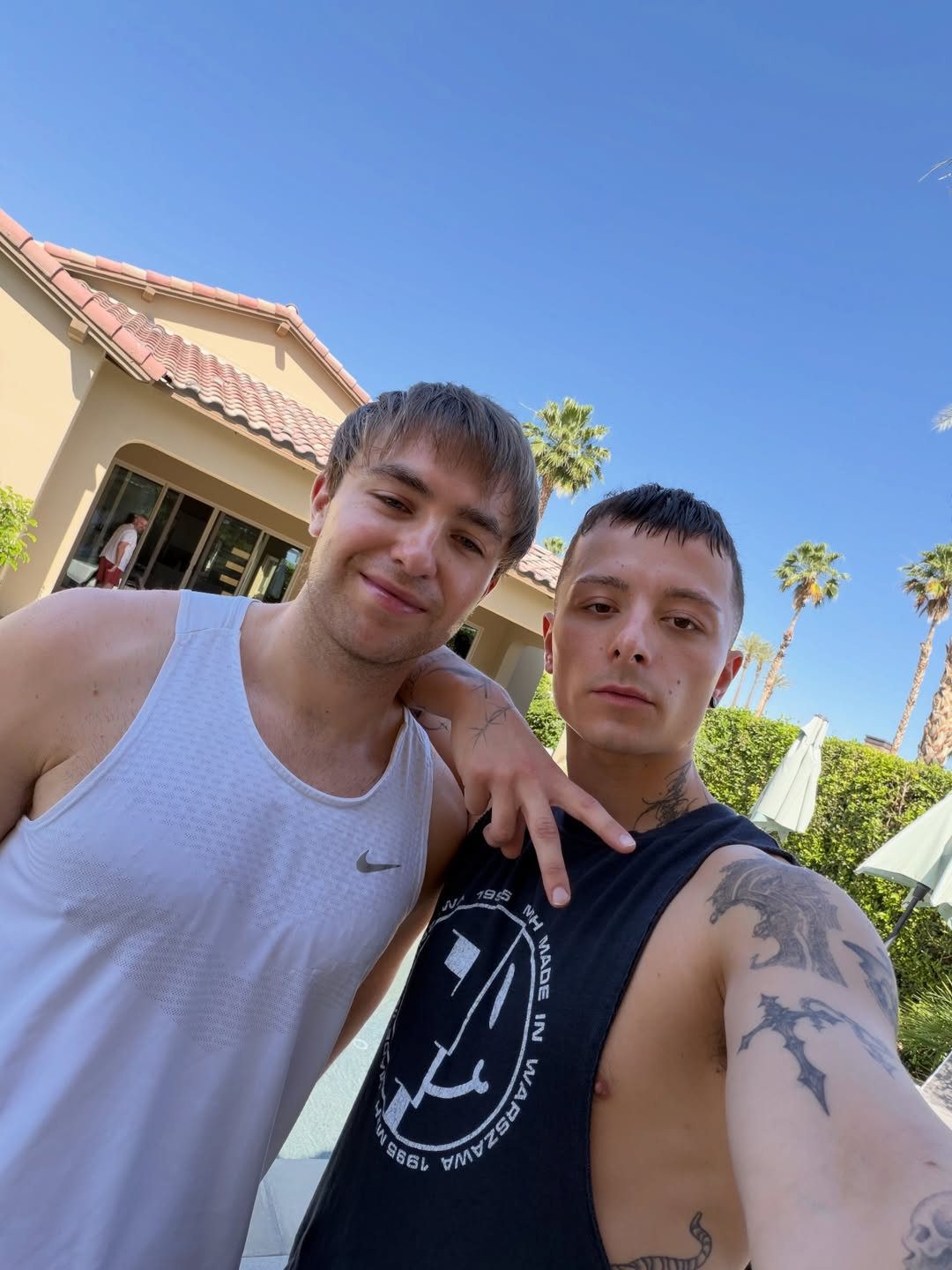 Prospa duo Harvey Blumler and Guiorgi “Gosha” Smith posing together outdoors during Coachella weekend in California.