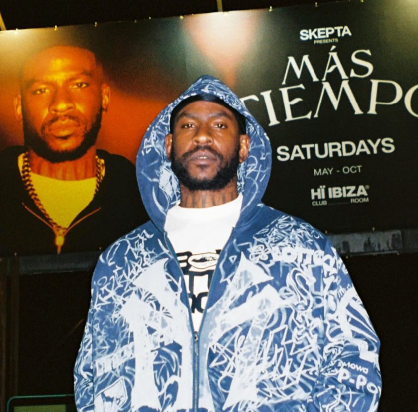 Skepta in front of the Mas Tiempo Saturdays backdrop at Hi Ibiza Club Room