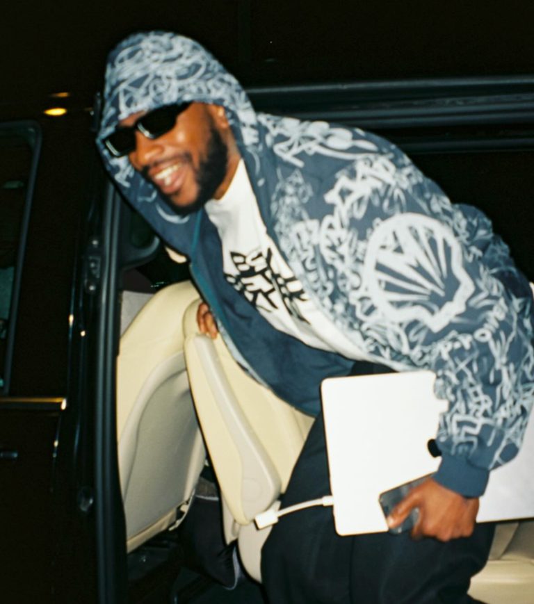 Skepta in sunglasses and a patterned hooded jacket, the Boy Better Know artist behind Mas Tiempo